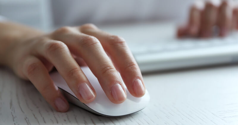 A person using a mouse and keyboard