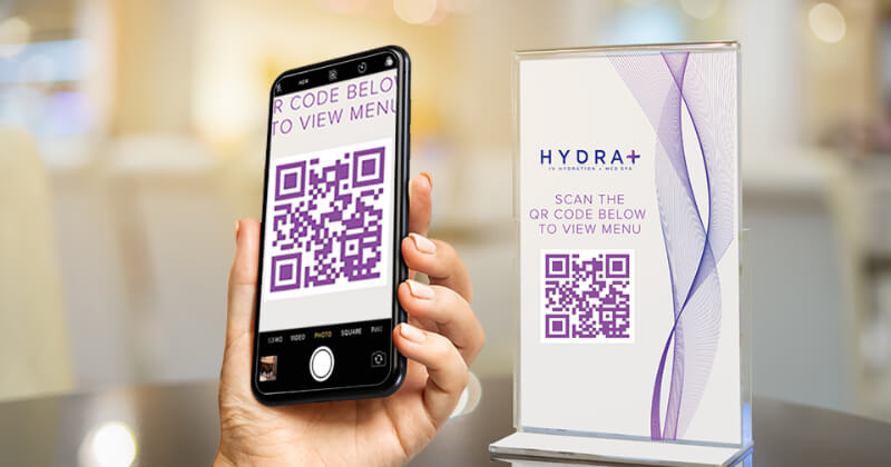 A mobile phone scanning a qr code in the Hydra Plus office